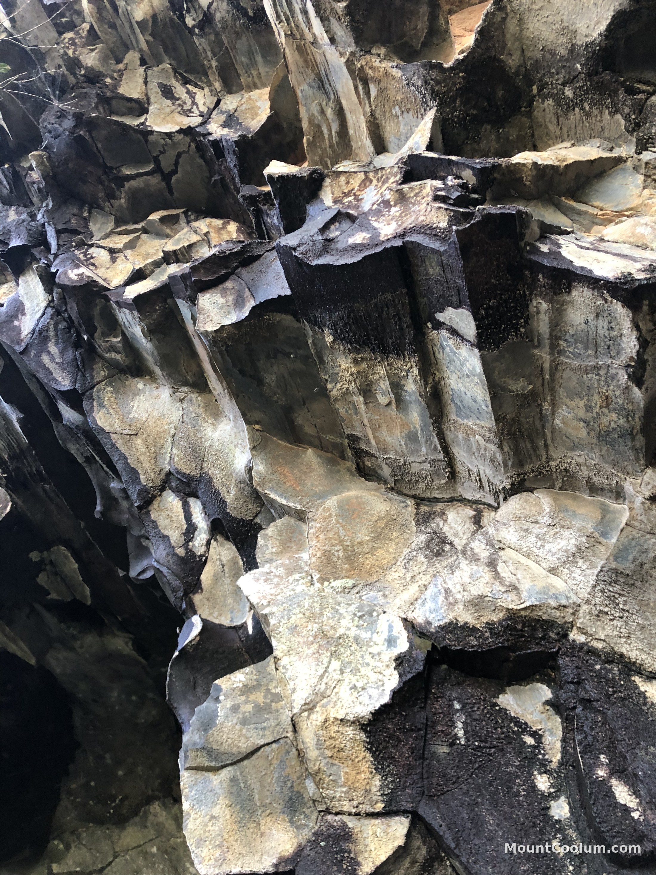 Close-up detail of the fractured rhyolite rock inside the Mount Coolum cave